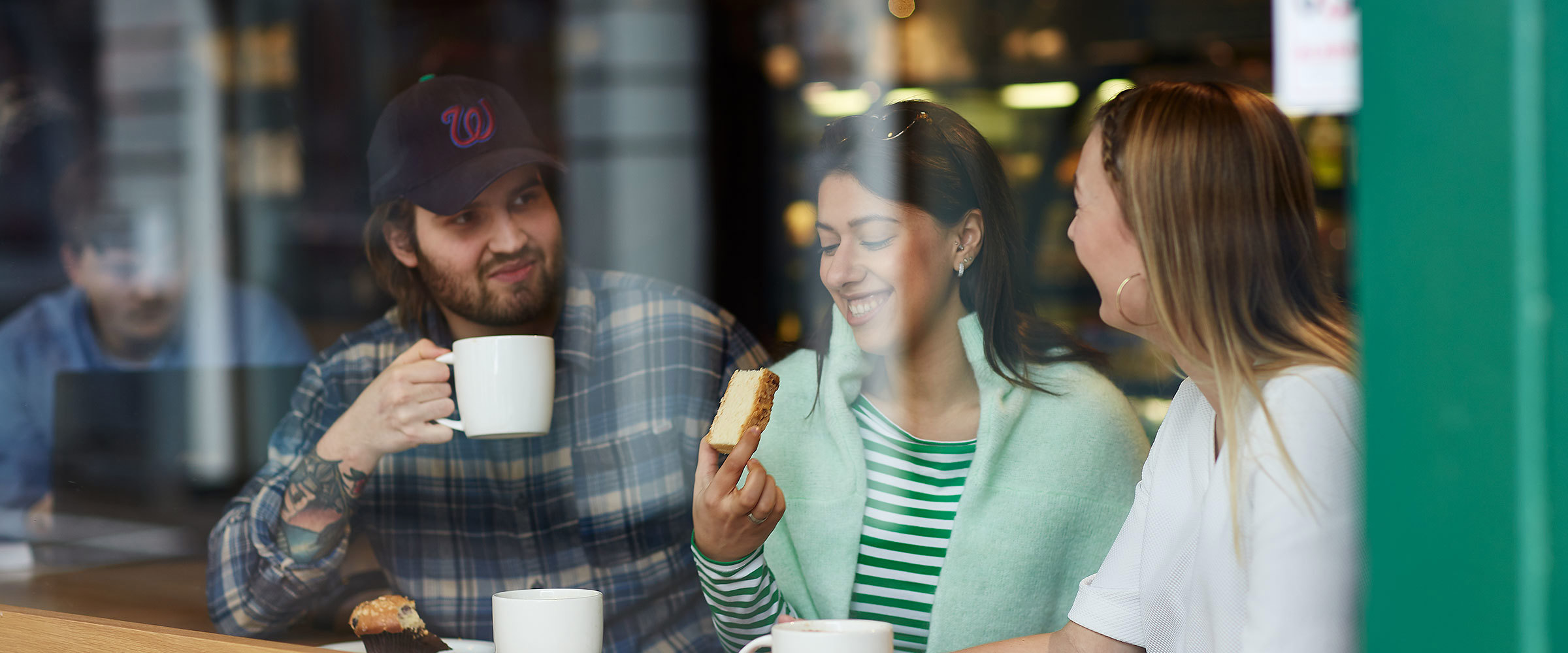 Three people drinking coffee